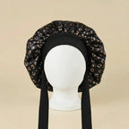 Bonnet de nuit en satin à attaches coloris Motif léopard noir — packshot premium