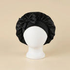 Bonnet de nuit en satin à bandeau large à nouer coloris Noir — packshot premium