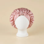 Bonnet de nuit en satin à bandeau large à nouer coloris Rose — packshot premium