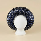 Bonnet en satin réversible à large collerette coloris Motif floral bleu marine — packshot premium