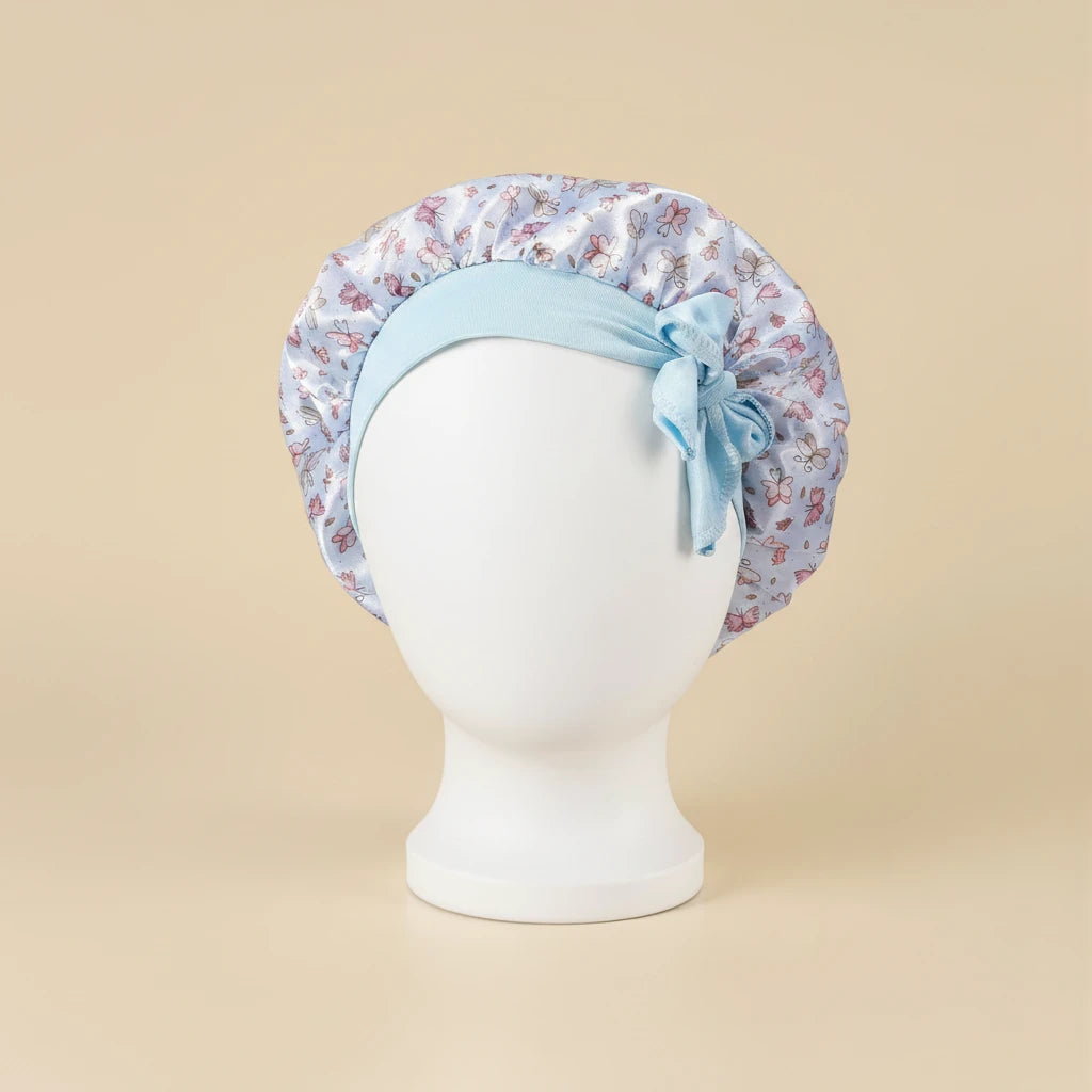 Bonnet en satin bébé motif floral, coloris bleu