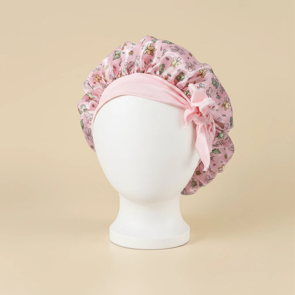 Bonnet en satin bébé motif floral, coloris rose