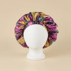 Bonnet en satin motif ethnique, coloris violet
