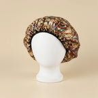 Bonnet en satin à motifs pour cheveux crépus coloris Baroque rose et doré — packshot premium