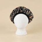 Bonnet en satin enfant motif floral, coloris noir