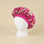 Bonnet en satin enfant motif floral, coloris rose foncé