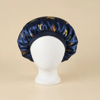 Bonnet en satin enfant motif papillons, coloris bleu marine