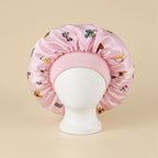 Bonnet en satin enfant motif papillons, coloris rose