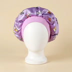 Bonnet en satin enfant motif papillons, coloris violet