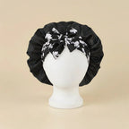 Bonnet en satin imprimé floral, coloris noir