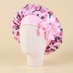 Bonnet en satin fille motif fruits à nœud, coloris rose