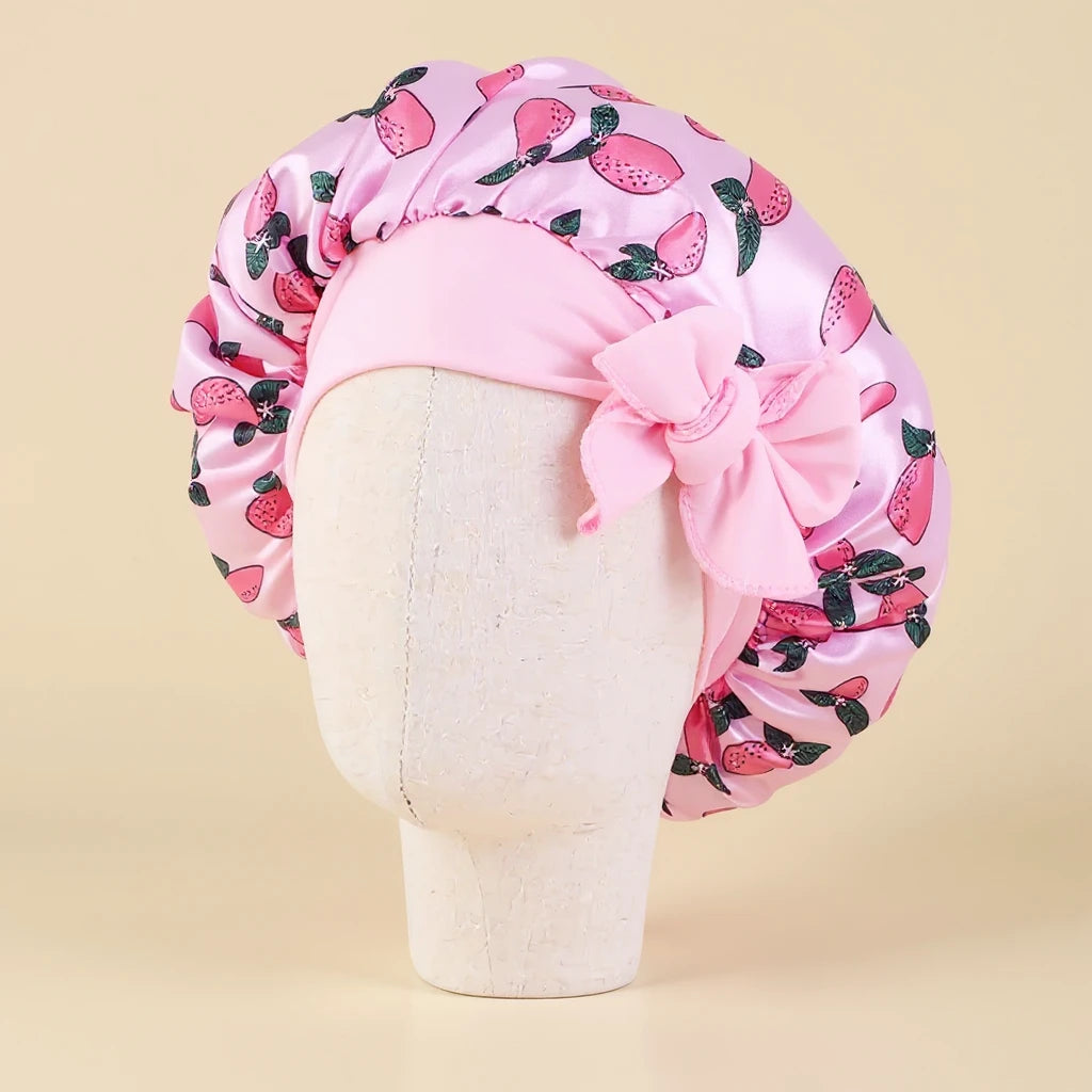 Bonnet en satin fille motif fruits à nœud, coloris rose