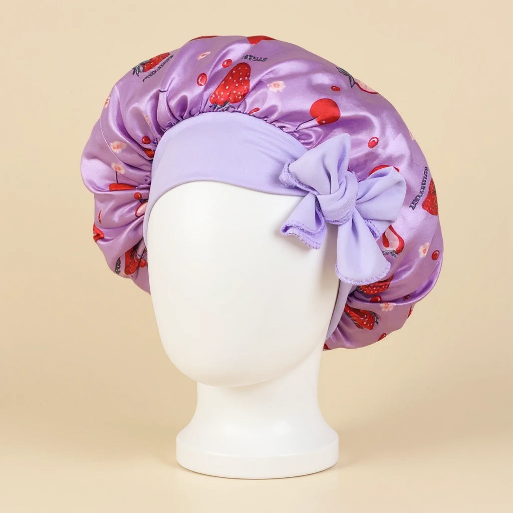 Bonnet en satin fille motif fruits à nœud, coloris violet