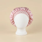 Bonnet en satin à bande perlée, coloris rose